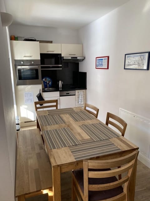 The dining table set up for 6. It can be expanded to increase capacity to 8.