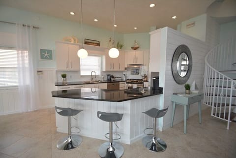 Main level kitchen with bar sitting