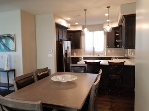 Dinning Table seats 6 and the Kitchen Bar seats 2