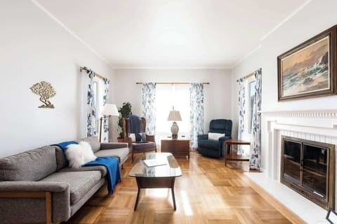 Inviting lounge with comfortable sofas, natural light, and a fireplace that adds warmth and charm.