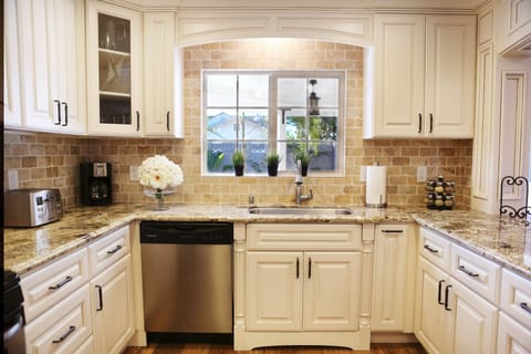 Custom Kitchen with granite countertops and stainless steel appliances