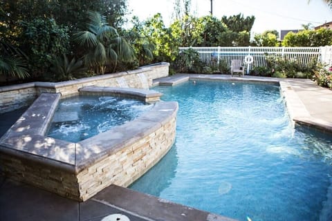Beautiful In-ground PebbleTech Pool with Jacuzzi