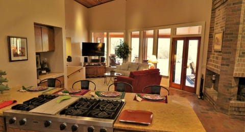 Seating that is convenient to what is going on in the kitchen.