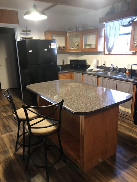 Kitchen includes single cup coffee maker, microwave, toaster, etc.