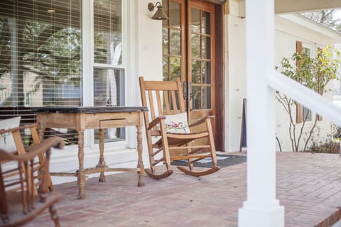 come and relax on the front porch and watch the world go by