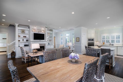 Dining table seats 10 by adding folding chairs at ends of the table. plus, 3 counter seats!