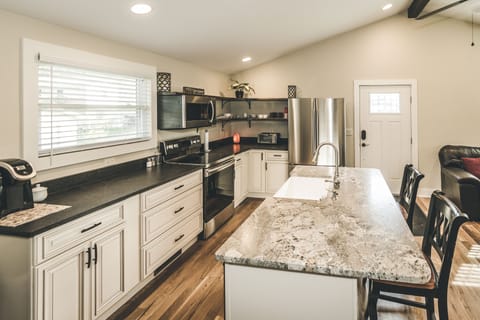 Granite and stainless steel appliances.