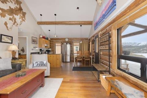 Living room with vaulted ceiling, Smart TV, views, open to kitchen/dining