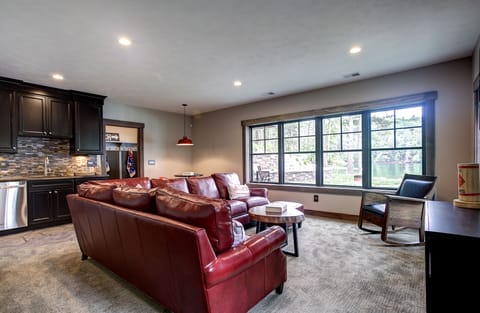 The walkout basement is where you can enjoy a movie and a view of the lake