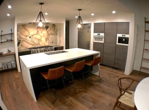 Kitchen - 48" Viking range, Miele espresso machine, bau format cabinets.