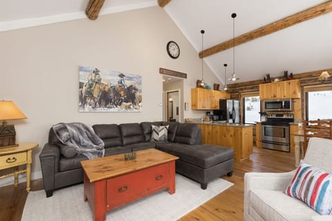 Large open living room w/Smart TV, gas fireplace/stove, new furnishings.