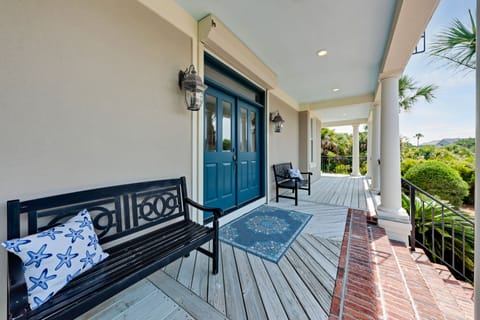 Large front porch wraps around the front floor of this home