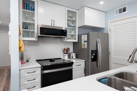 Well equipped kitchen with stainless steel appliances