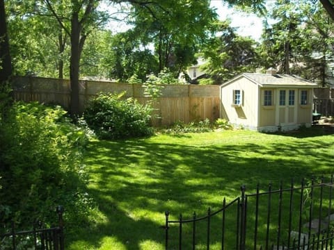 Backyard with plenty of space to play and entertain. Outdoor dinning set & Grill
