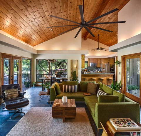 Main house living room stocked with books, games, yoga mats, children books. 