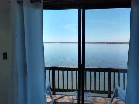 View of the beautiful lake from boathouse balcony rocking chairs