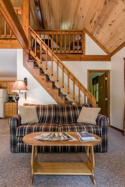 Loft bedroom is above the sofa. Main floor bath on right side of photo. 