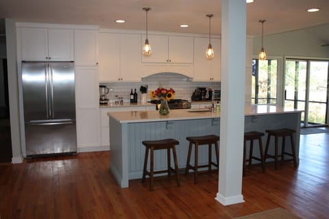 Newly remodeled kitchen with large 10ft island, stainless steel appliances.