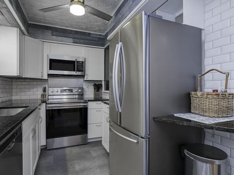 The updated kitchen is fully equipped for you to create your meals.  New appliances and painted cabinets update the kitchen!