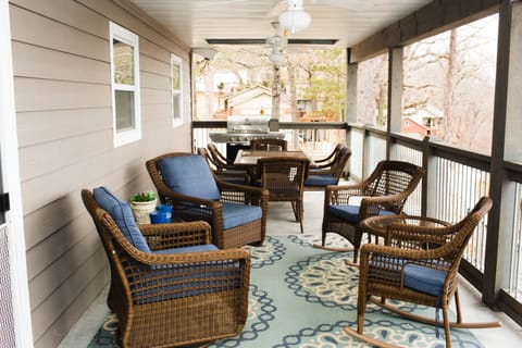 large covered balcony on the back of the house