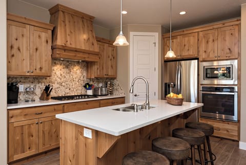 Spacious living room with sliding glass doors that open to patio - The Kitchen is complete with everything you will need for meal preparations including pots, pans, baking dishes, plates, cups, silverware, cutlery, and an assortment of cooking utensils