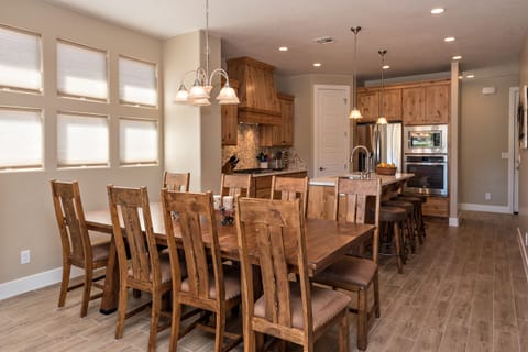Dining Table - Spacious dining table seats 8 or add the bench from the entry way and there's room for 12. Bar stools provide additional seating.