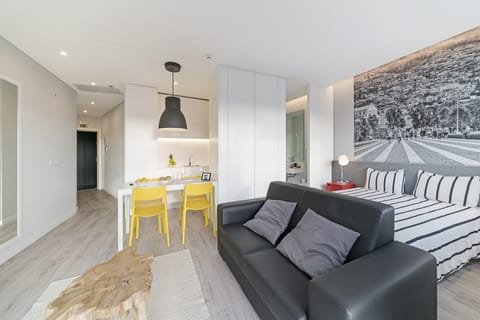 Livingroom and dining area , kitchen and bed