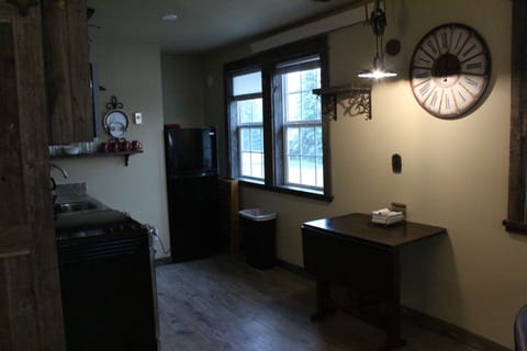 looking into dining area, front door to the lower right seating for four