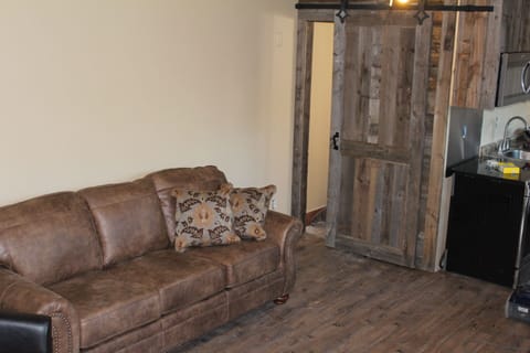 Bathroom with shower, stool, sink just through the sliding door