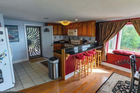 Front door, kitchen, and breakfast nook.