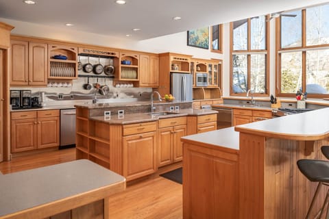Three sinks, two dishwashers, and a walk-in pantry are just a few of the gourmet kitchen amenities