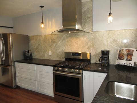 Newly remodeled apartment features stainless steel appliances and quartz counter
