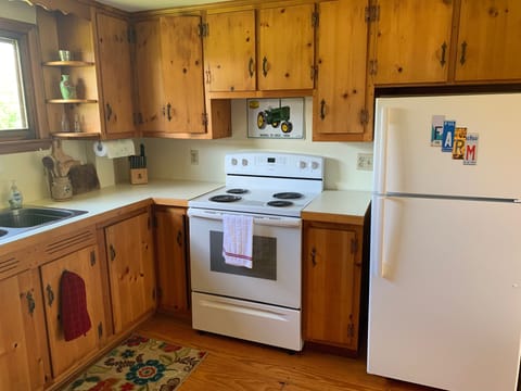 Hand-hewn pine cabinets in the farmhouse kitchen.