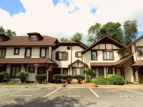 Front view of the condo with marked parking spaces