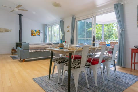 Spacious living and dining open out to tree top deck