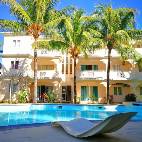 your villa is on the left,  ground floor with patio .