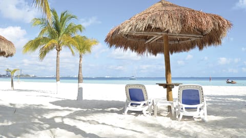 Palapas on the beach for exclusive use of the condo complex