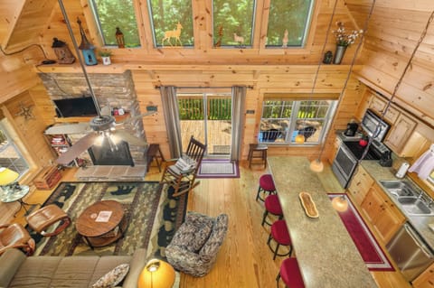 View from upper level of stunning open main level kitchen and living room areas.