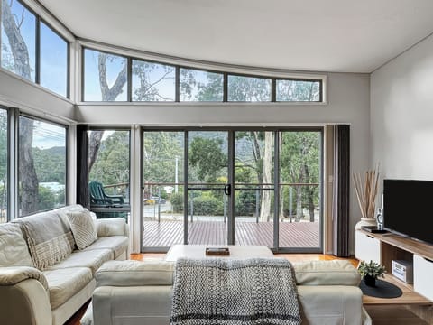Stylish living: Scenic views, natural light, TV. Perfect comfort and entertainment.