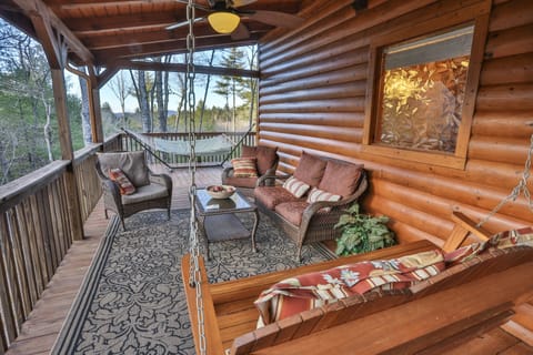Enjoy the sounds of nature on the covered deck.
