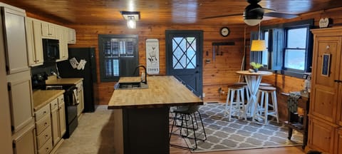 Kitchen seats 4 at breakfast bar & 4 at nook.Backdoor leads to screened in porch