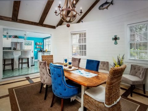 Huge dinning room with 20 foot cathedral ceiling and custom made long table