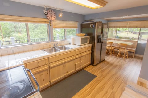 Sunny kitchen has views of the lake