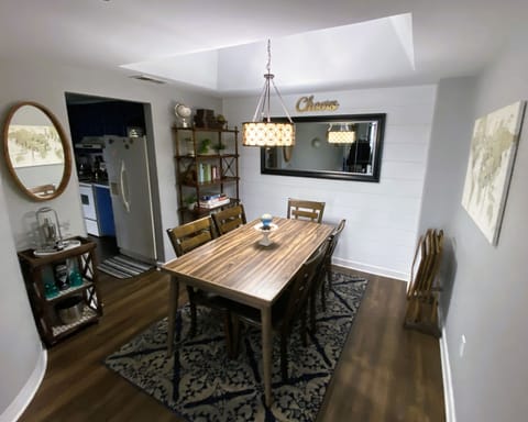 Dining area with bar cart and a book nook for those who love to read.