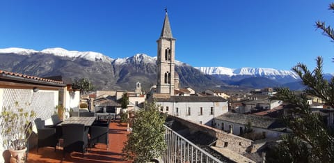 Table for six on the terrace as well as seating area and two sun beds.
