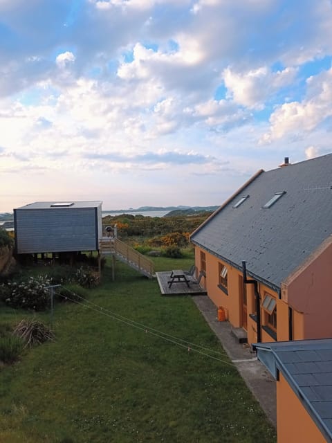 Enclosed back garden featuring the Summer house