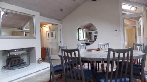 Large dining room with open log fire