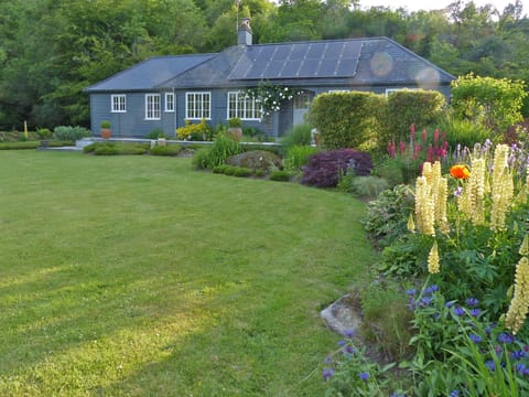 Detached timber framed luxury home on Dartmoor surrounded by large gardens.