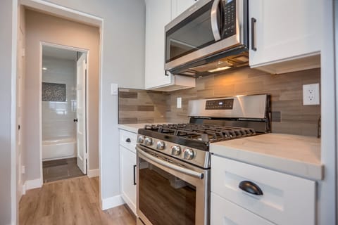 Fully stocked kitchen with stainless steel appliances