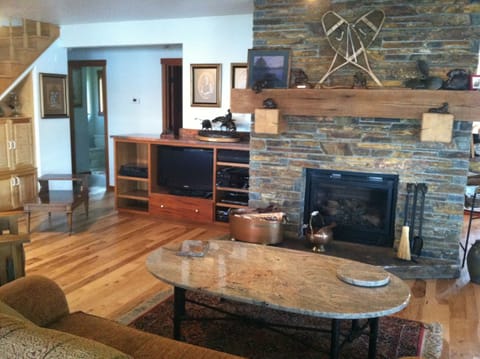 one of two seating areas. This one has a custom rock fireplace.